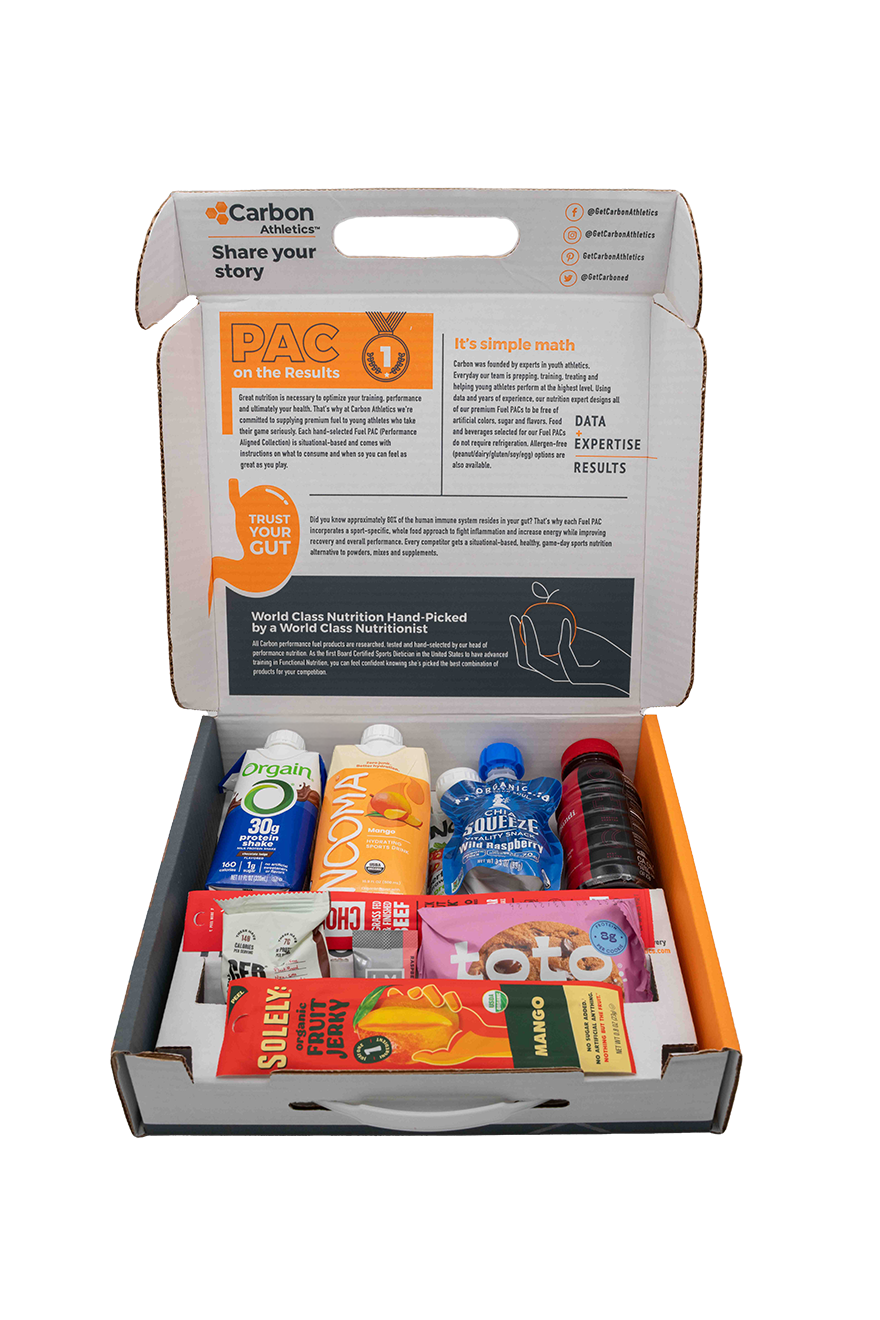 Box containing various food items with visible branding on a white background