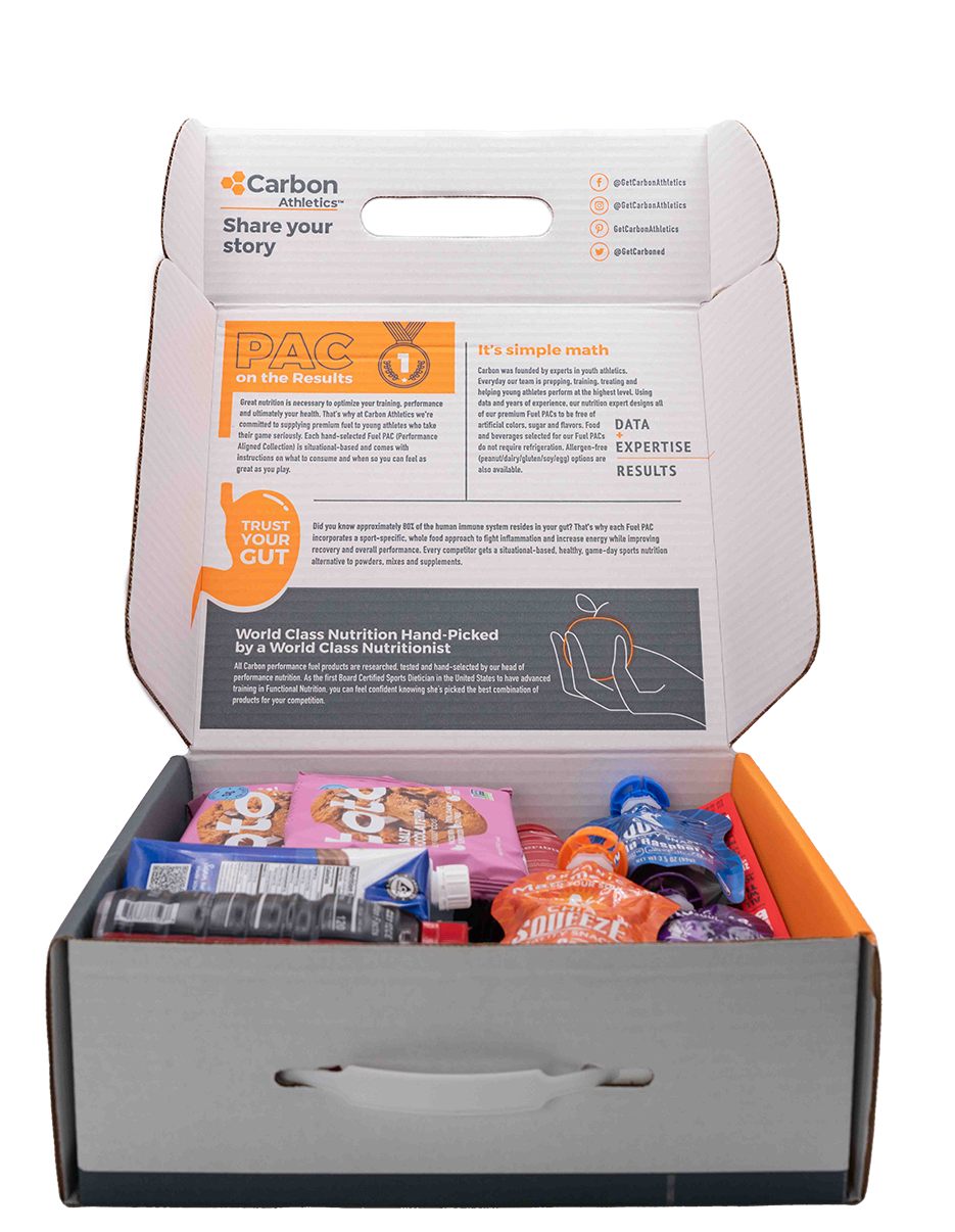Open box containing various food items with visible branding on a white background
