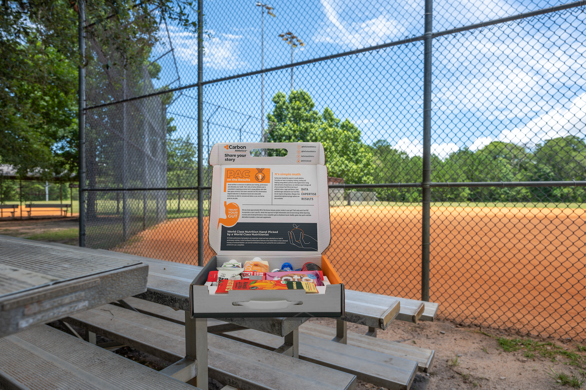 Outdoor setting with a picnic table and sports equipment on a sunny day.