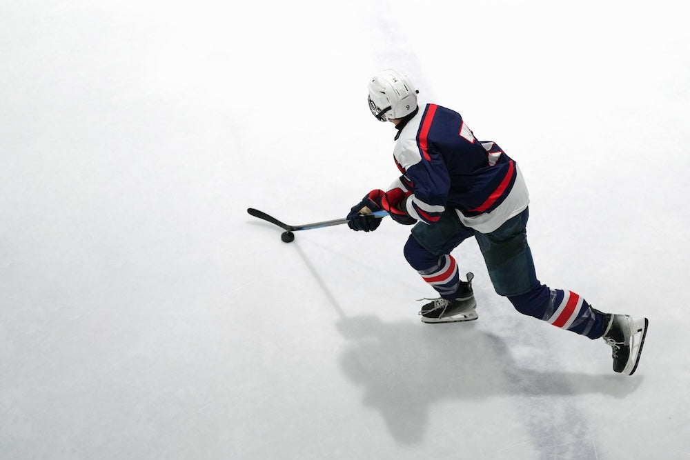 Hockey player in action on an ice rink