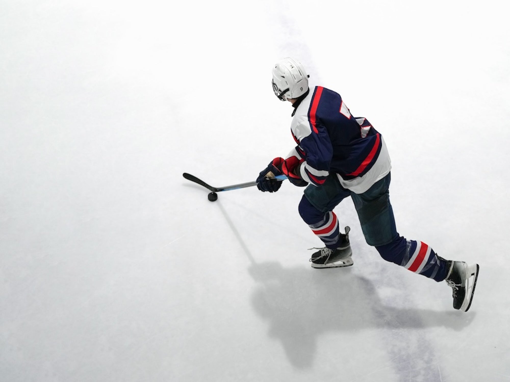 Hockey player in action on an ice rink